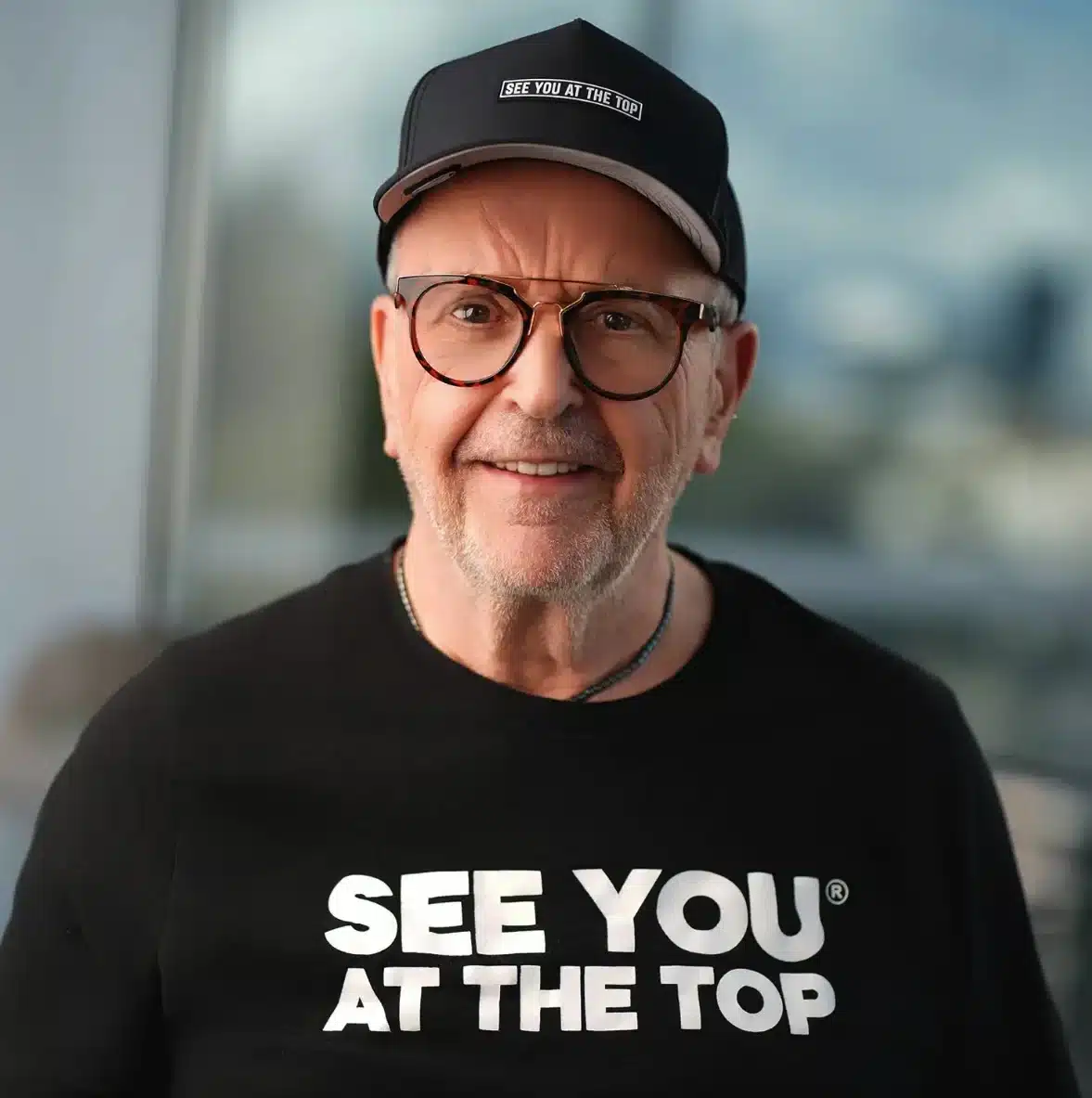 Man wearing cap and t-shirt.