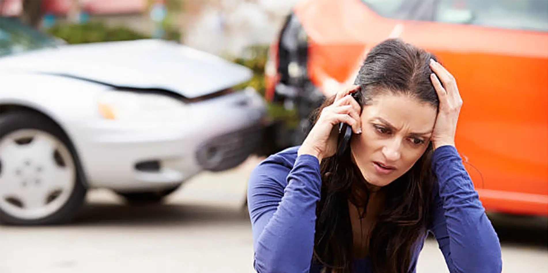 Woman distressed after car accident.