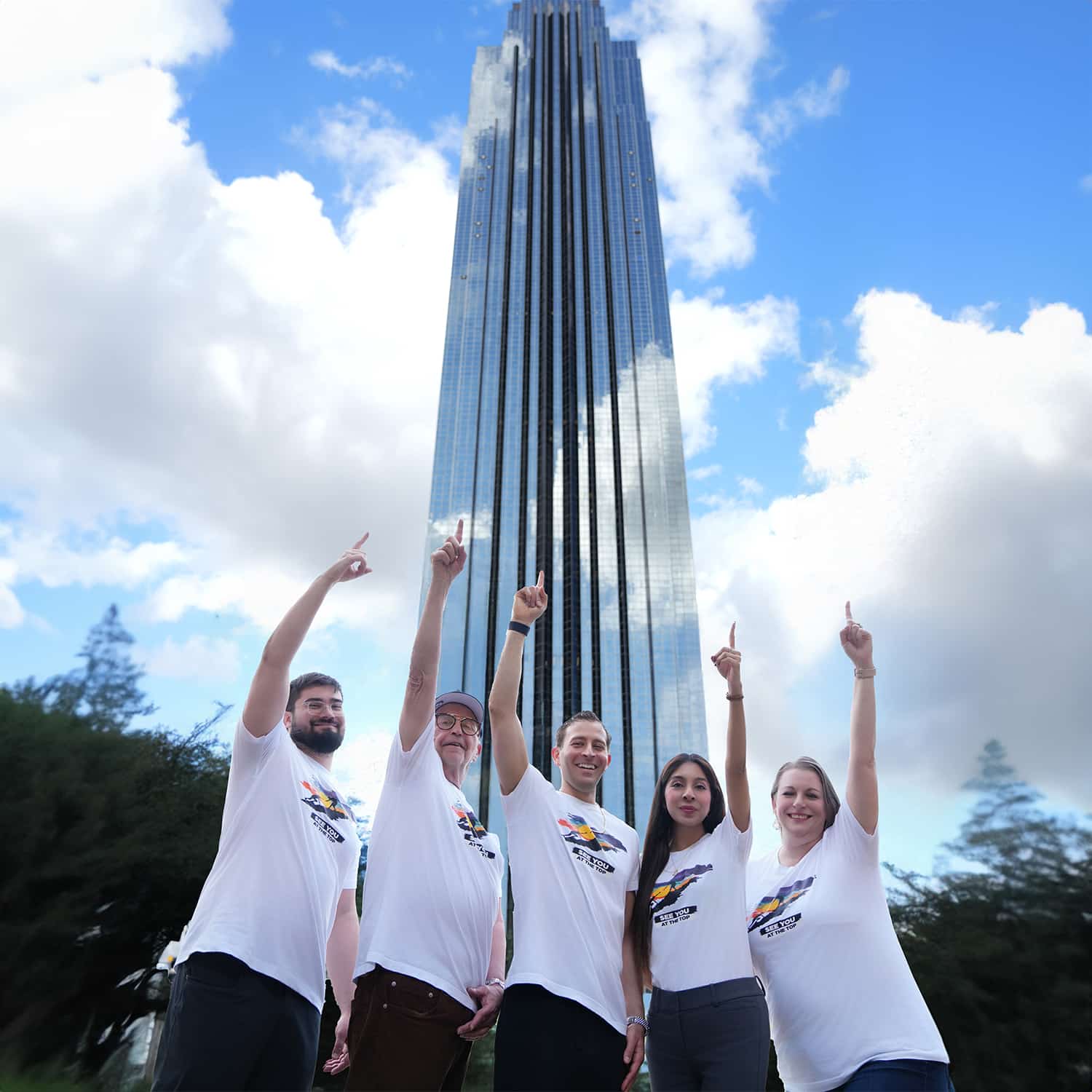 Group of people in front of skyscraper