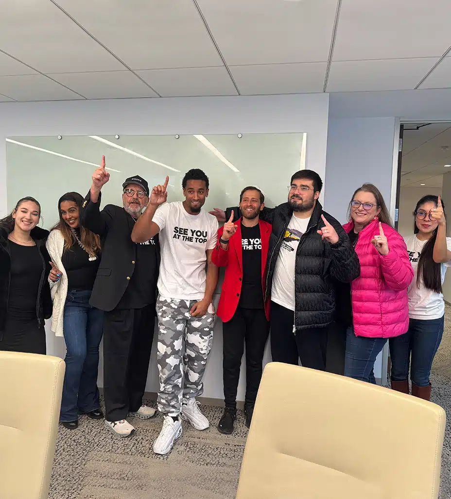 Group of people posing together.