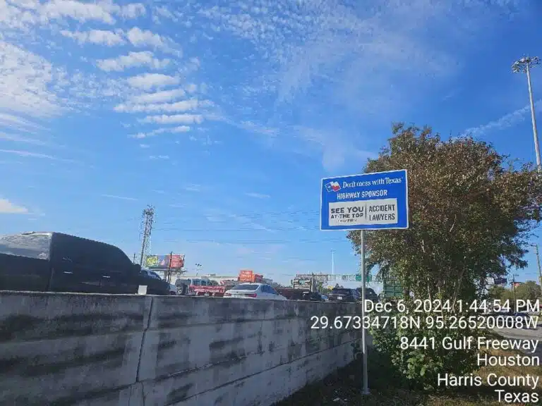 Highway sign with blue sky