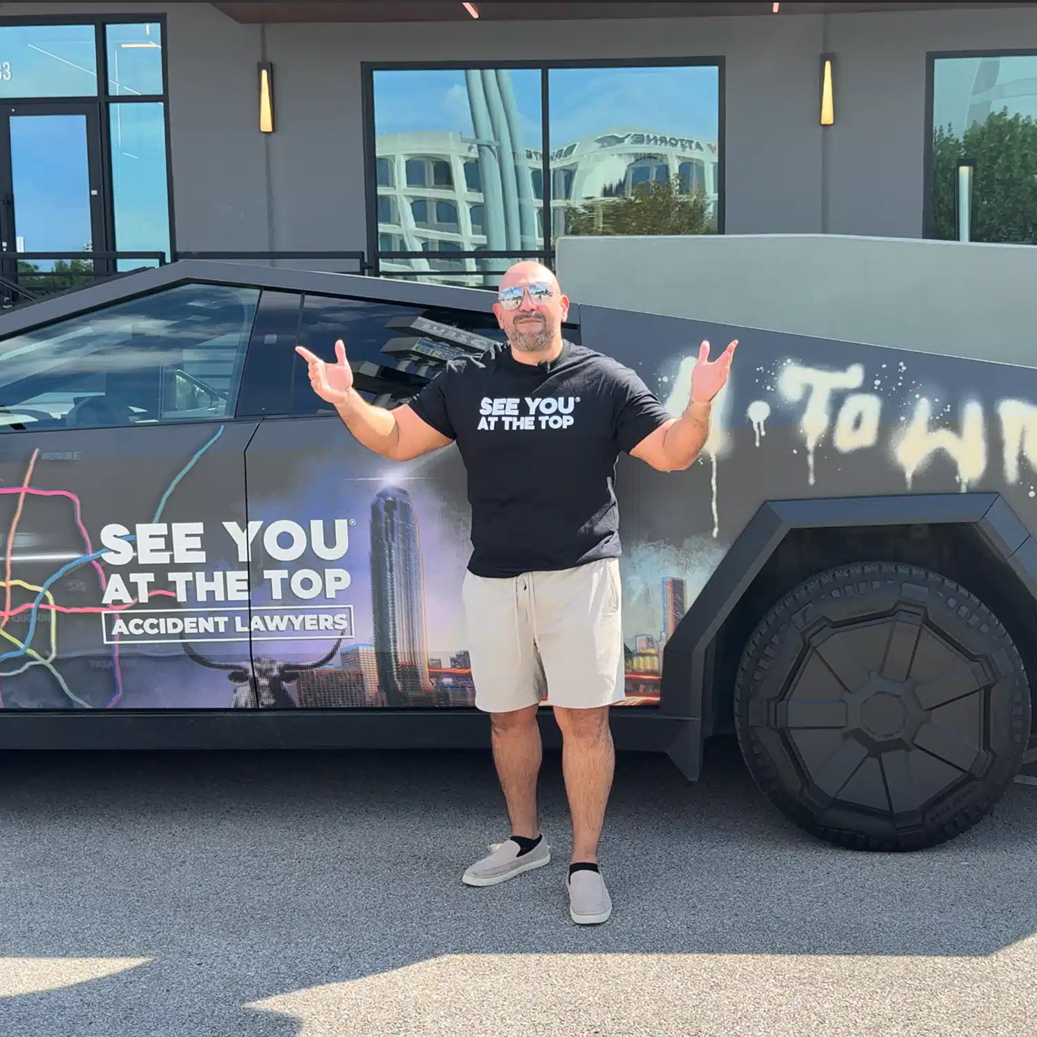 Image of Gavriel Puig with arms wide open in front of iconic cyber truck in houston texas after his big win of $850,000!