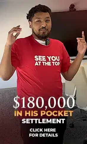 Man in red shirt, settlement announcement.